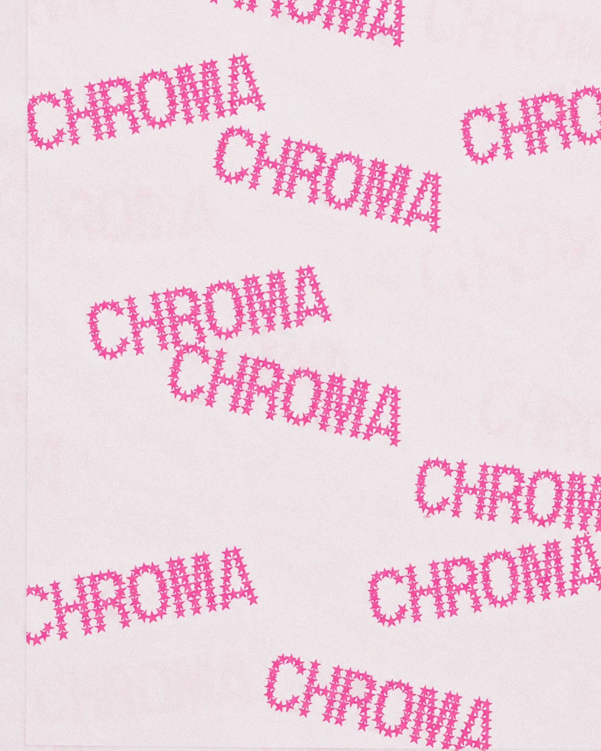 Pink tissue paper printed with CHROMA spelled out in small stars