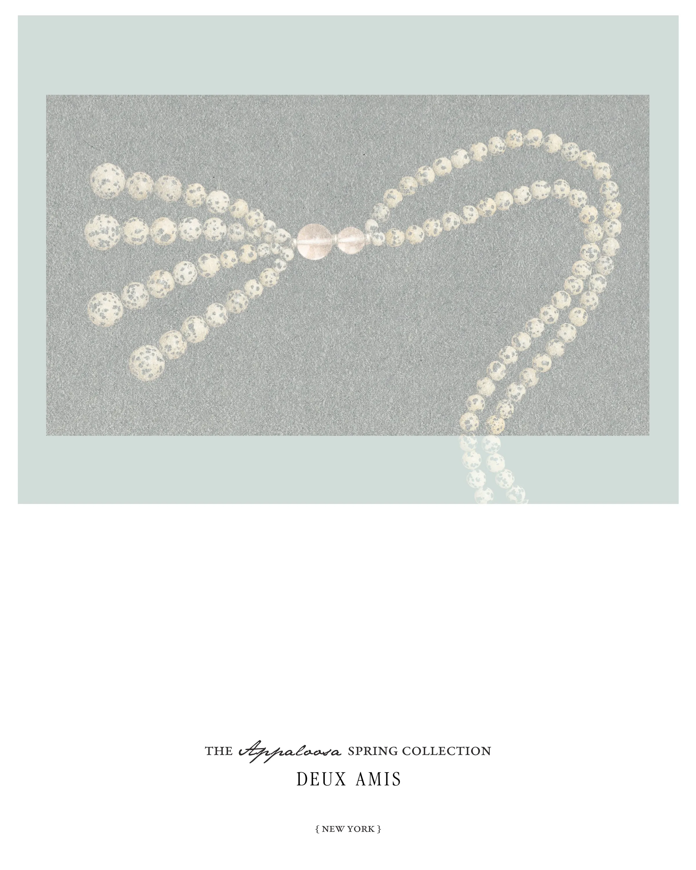 Deux Amis post: long Dalmatian jasper bead necklace on pale blue above the Appaloosa Spring Collection title