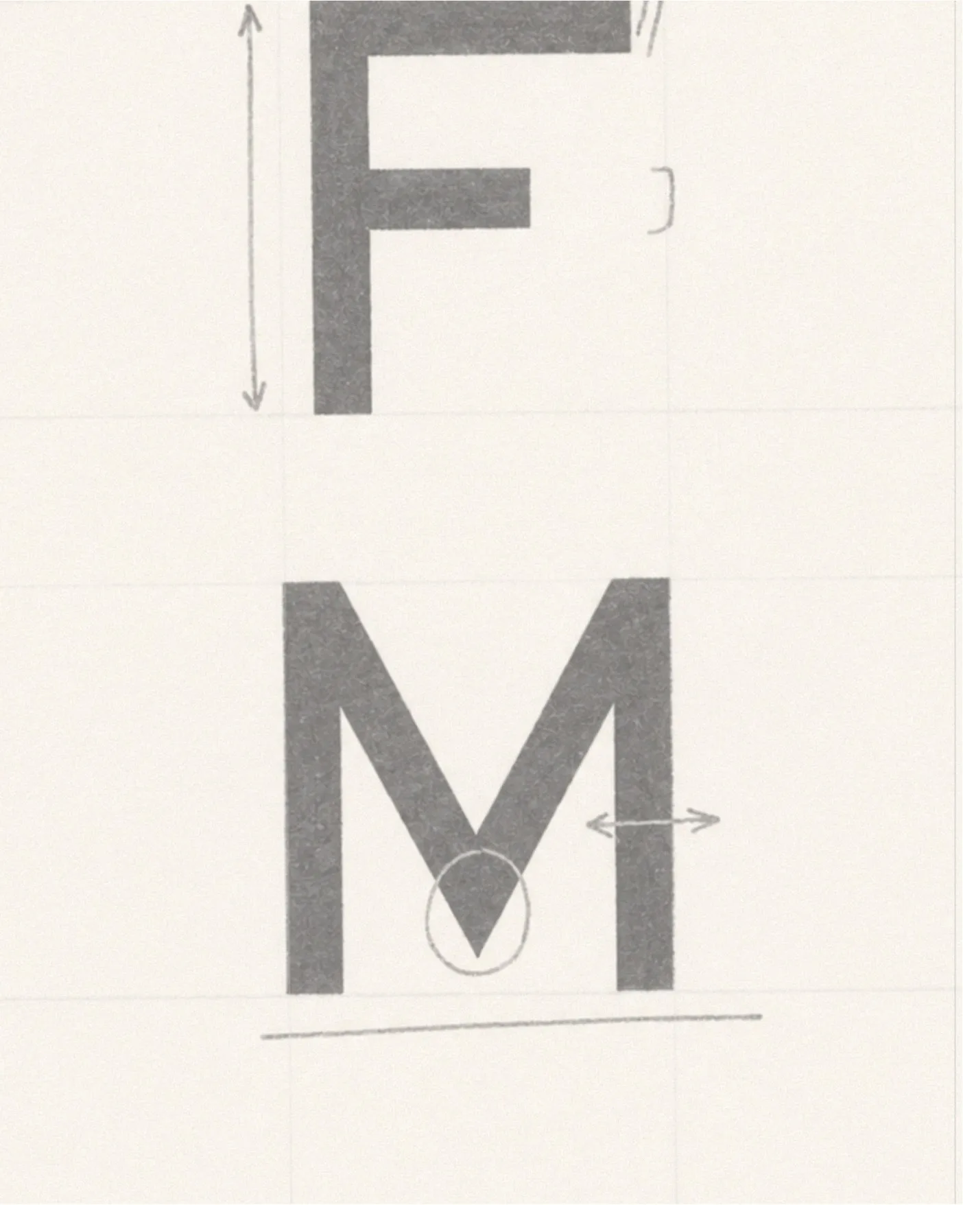 Pencil sketch of the vertical FM abbreviation with construction marks