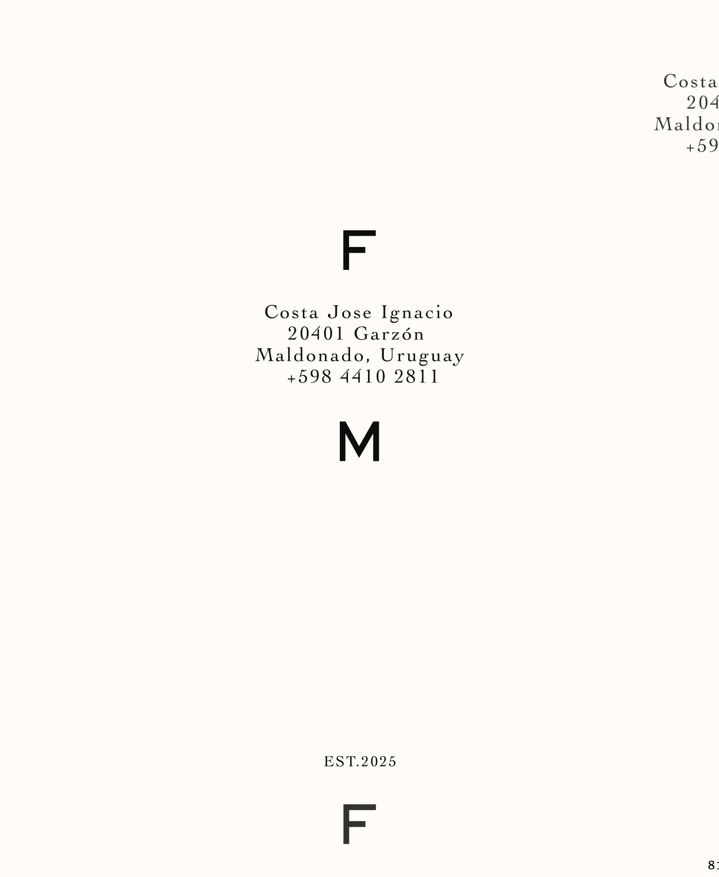 Vertical FM monogram framing the Garzón address in serif type, EST. 2025, on cream