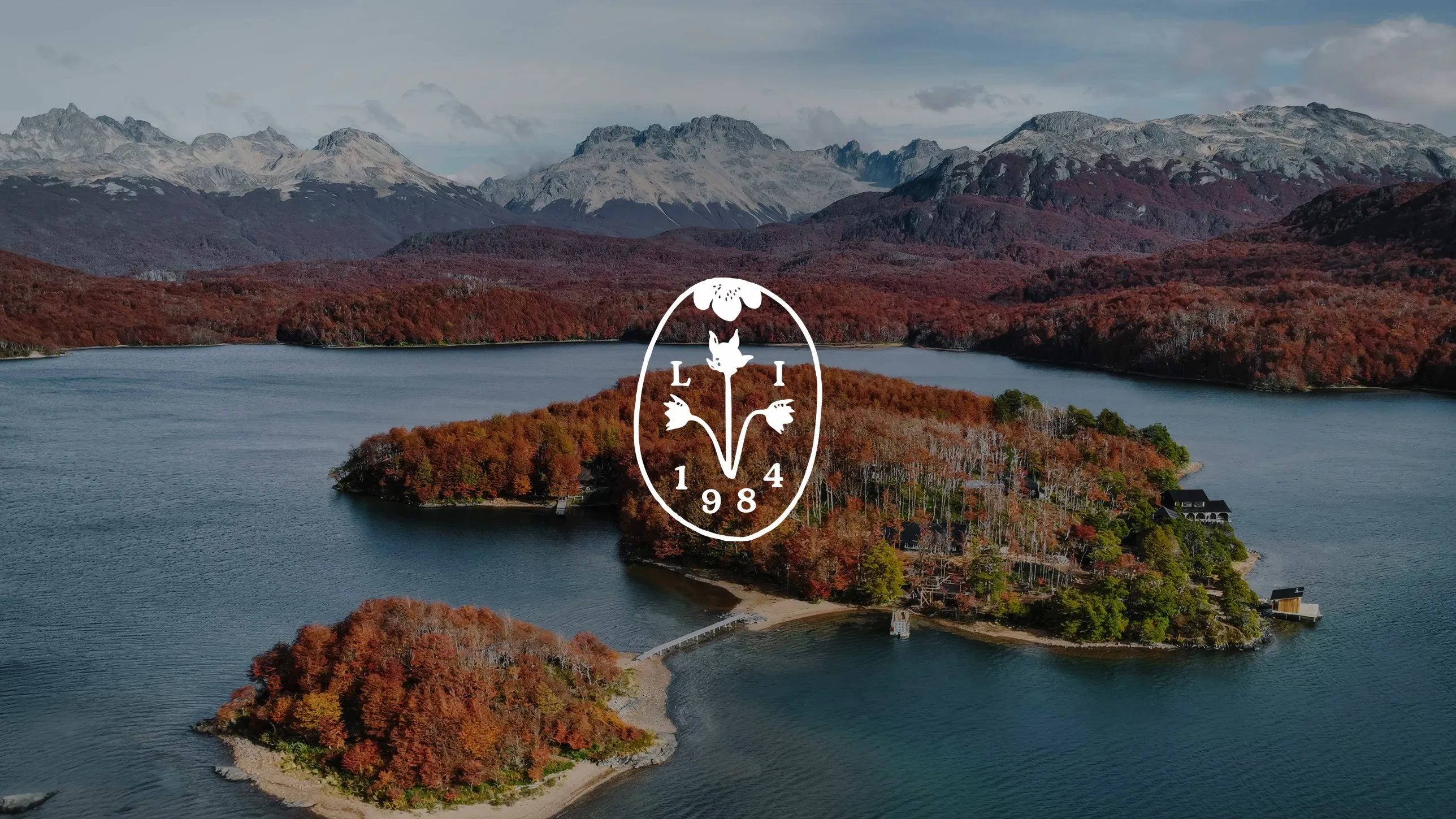 La Isla seal over an aerial view of the island in autumn, Lago de la Plata, Patagonia