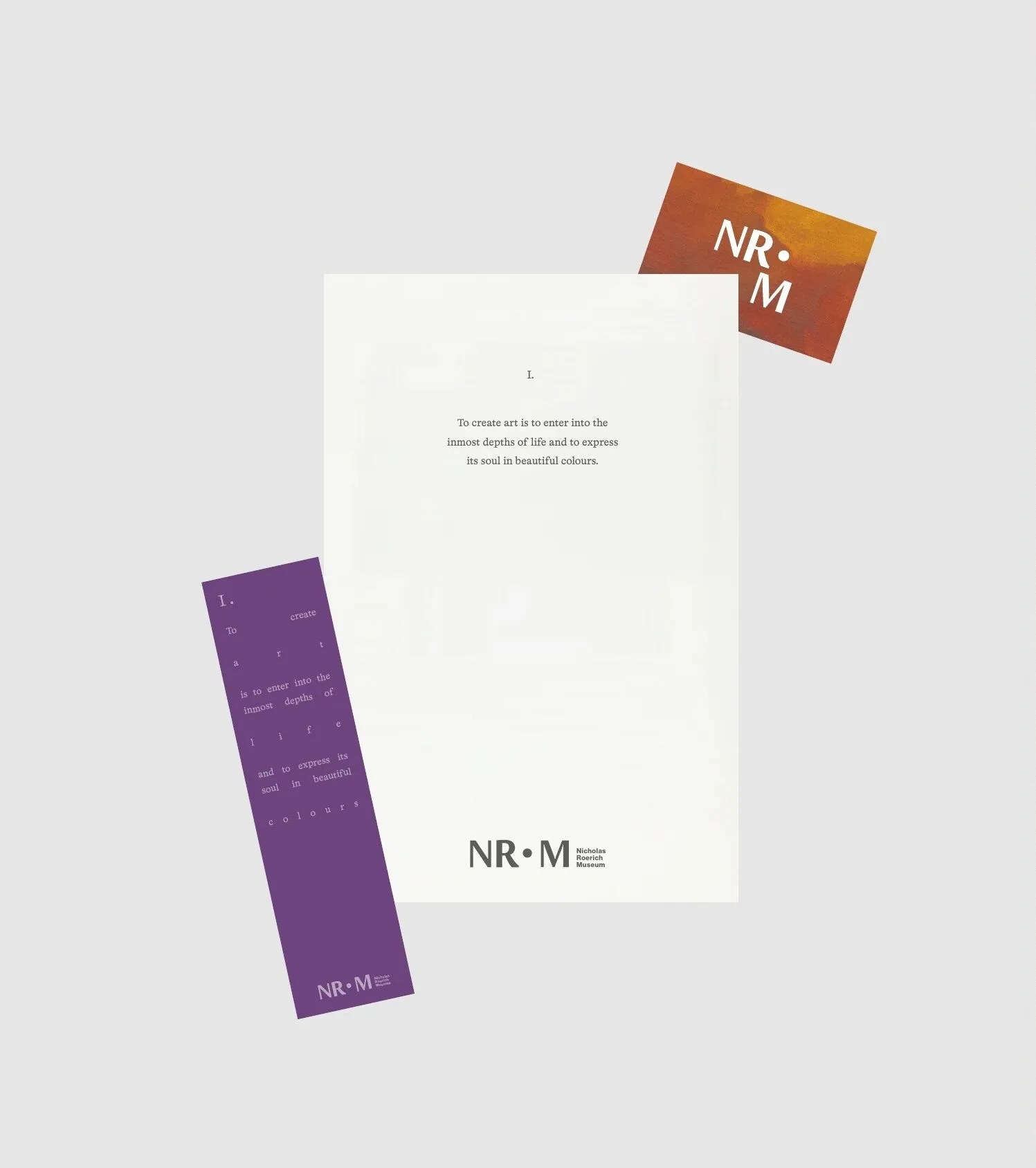Letter, purple bookmark and coral card with the NR•M logotype
