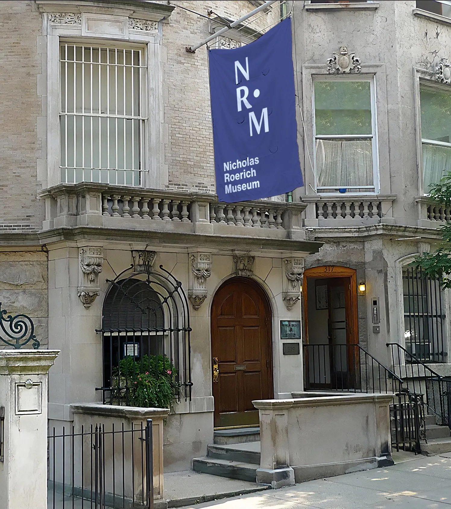 Navy NR•M flag on the museum's townhouse facade in New York