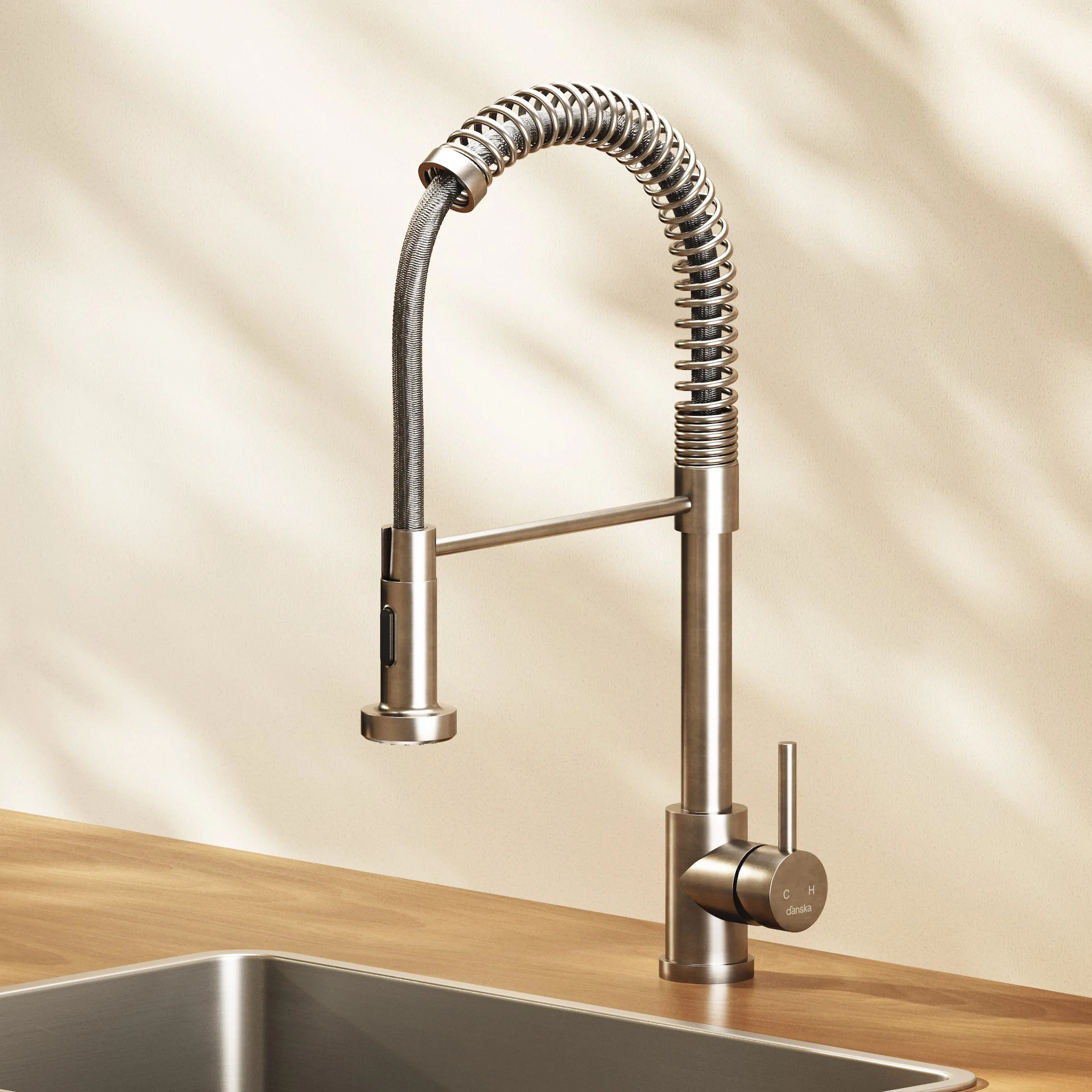 Danska render of a steel pull down kitchen faucet over a sink