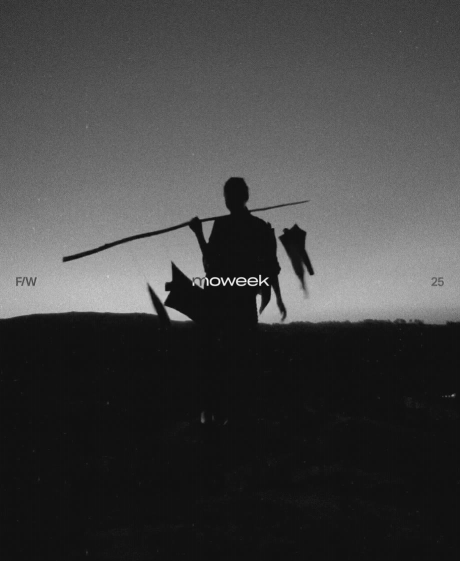 Moweek F/W 25 wordmark over a silhouetted figure carrying a pole at dusk